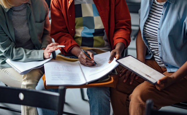 Group of Anonymous Students Studying Together