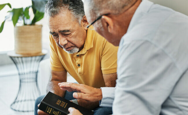 Two men discussing the Bible together