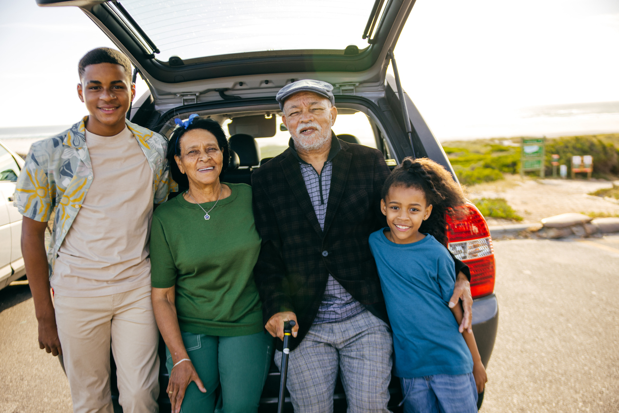 Family sitting on their trunk